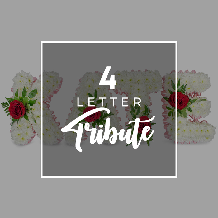 This image offers a tender, close-up view of a custom MUM floral tribute created for a funeral or memorial, the kind of arrangement often seen resting near the front of a service in Grove Park. Three large, three-dimensional letters - M, U, and M - are positioned side by side on a pale, neutral surface. Each letter is completely covered in tightly packed white chrysanthemums, whose layered petals form a soft, cushion-like texture that speaks of purity, gentleness, and quiet remembrance. At the tops of the two Ms and in the curve of the central U, clusters of small red roses or rosebuds are carefully positioned, their deep, velvety colour standing out vividly against the white background. Around these roses, small sprays of fresh green foliage spread like tiny fans, adding depth and a natural, garden-fresh feeling, as if the flowers had just been gathered from a nearby green space along the river. The shapes of the letters are crisp and well-defined, suggesting skilled hands have taken time to ensure every bloom is perfectly placed. The background is softly blurred and light grey, providing a calm, unobtrusive setting that allows the floral tribute to remain the clear focus. The mood is personal and intimate, reflecting the deep bond between a mother and her family, and how that love can be expressed through flowers when words are hard to find. This MUM tribute is captured in a way that highlights both the craftsmanship and the heartfelt sentiment behind it.