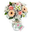 This radiant bouquet, arranged with care by Grove Park Florist, blends the softness of pastel hues with the crisp freshness of spring. Peach-pink roses unfurl at the center, their velvety petals offering warmth and a classic romantic air. Flanking them, two lively peach gerberas with rich brown hearts provide contrast and a burst of sunny joy, recalling the happy blooms of Grove Park Gardens. Delicate sprays of baby's breath dance throughout, filling the spaces with fluffy clouds of white, while snowy chrysanthemums-each ringed with a zest of lime green-bring freshness and vibrancy. Eucalyptus leaves, cool and glossy, thread through the arrangement for a touch of grounded elegance. Nestled in a clear, subtly textured glass vase, the whole ensemble is tied with natural twine at the neck, topped with an understated blank white tag. Visible water and stems guarantee freshness-perfect for same-day delivery throughout Grove Park. Ideal for anniversaries, birthdays, or just because, this bouquet radiates heartfelt cheer and quiet sophistication.