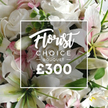 A close-up, richly detailed image captures the luxurious Florist Choice Bouquet, priced at ?300, set to charm anyone in Grove Park and beyond. The arrangement presents an abundant display of fresh, premium flowers, dominated by white roses in multiple stages of bloom, their velvety petals softly curling. Nestled among them are white lilies, their broad petals gleaming with a satin sheen and inner petals touched with a gentle pink flush that catches the light. Subtle accents appear as smaller pink blossoms, like delicate confetti within the halo of white, while clusters of green foliage-eucalyptus-like leaves-provide cool, aromatic contrast and depth, giving the bouquet a natural, garden-fresh feel.

The frame is filled with lush blossoms, yet the composition remains elegant and balanced. A crisp white rectangular overlay sits across the centre, bordered by a fine line, bearing the words Florist in a flowing script, followed by CHOICE BOUQUET in uppercase sans-serif, and the price ?300 in bold white numerals. This overlay reads as a badge of specialty, a promise of careful selection and expert arrangement. The overall mood is one of refined opulence, suitable for a thoughtful gift or a celebration that calls for quiet grandeur. In Grove Park, this bouquet is a favorite for birthdays, anniversaries, or to convey sympathy with grace, and it can be delivered with care to nearby streets, parks, and homes. The scent of fresh blooms and the cool, clean line of the white typography together create a moment of serene luxury in a busy day.