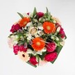 Like a joyful chorus of colour and texture, this bouquet is perfect for commemorating life's happiest occasions in Grove Park. At its heart, vibrant orange gerberas blaze with positive energy, surrounded by lush magenta carnations and tender blush roses, their layers of soft, full petals inviting a gentle, appreciative touch. Subtle accents of snowy alstroemeria and petite white daisies brighten the design, recalling the lightness of early morning dew on garden walks near Grove Park's tranquil green spaces. Encased within abundant, glossy greenery, the arrangement's rich palette transitions smoothly from bold to pastel, creating a harmonious flow of warmth and optimism that mirrors the spirit of the neighbourhood. Crafted with the fresh-picked flair of a local florist, this bouquet is equally at home at a birthday gathering or as an uplifting surprise delivered to a doorstep along Burlington Lane. It radiates the promise of spring, the artistry of Grove Park's floral experts, and a heartfelt wish for happiness and renewal.