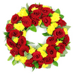 This image shows a classic funeral wreath presented against a seamless white background, its circular shape defined by a dense mass of deep red roses and vivid yellow chrysanthemums. The roses, which form the structural backbone of the arrangement, are fully open with plush, velvety petals spiralling gracefully from centre to edge. Their tones range from a strong, confident red to touches of darker burgundy at the outer petals, creating natural shading that gives the wreath a three-dimensional quality. Nestled between these roses are generous clusters of yellow chrysanthemums, their many fine, thread-like petals forming rounded, cushiony blooms that bring softness and warmth to the design. The dialogue between red and yellow creates a mood that is both respectful and gently optimistic, fitting for a service of remembrance or a final farewell in the quiet streets and green spaces of Grove Park. Underpinning the flowers is a layer of glossy green foliage, with rounded leaves and a few more muted, grey-green sprigs that resemble eucalyptus, providing structure and subtle contrast. The flowers and leaves together form a complete, unbroken ring with an open middle, a visual reminder of endless love, continuity, and cherished memories. Clean, even lighting falls over the arrangement, highlighting the texture of each petal, the sheen of each leaf, and the overall balance of the design. It feels like a carefully composed tribute from a local Grove Park florist, ready to accompany a casket, stand beside a photo at a memorial, or rest quietly at a graveside as a final gesture of respect and compassion.